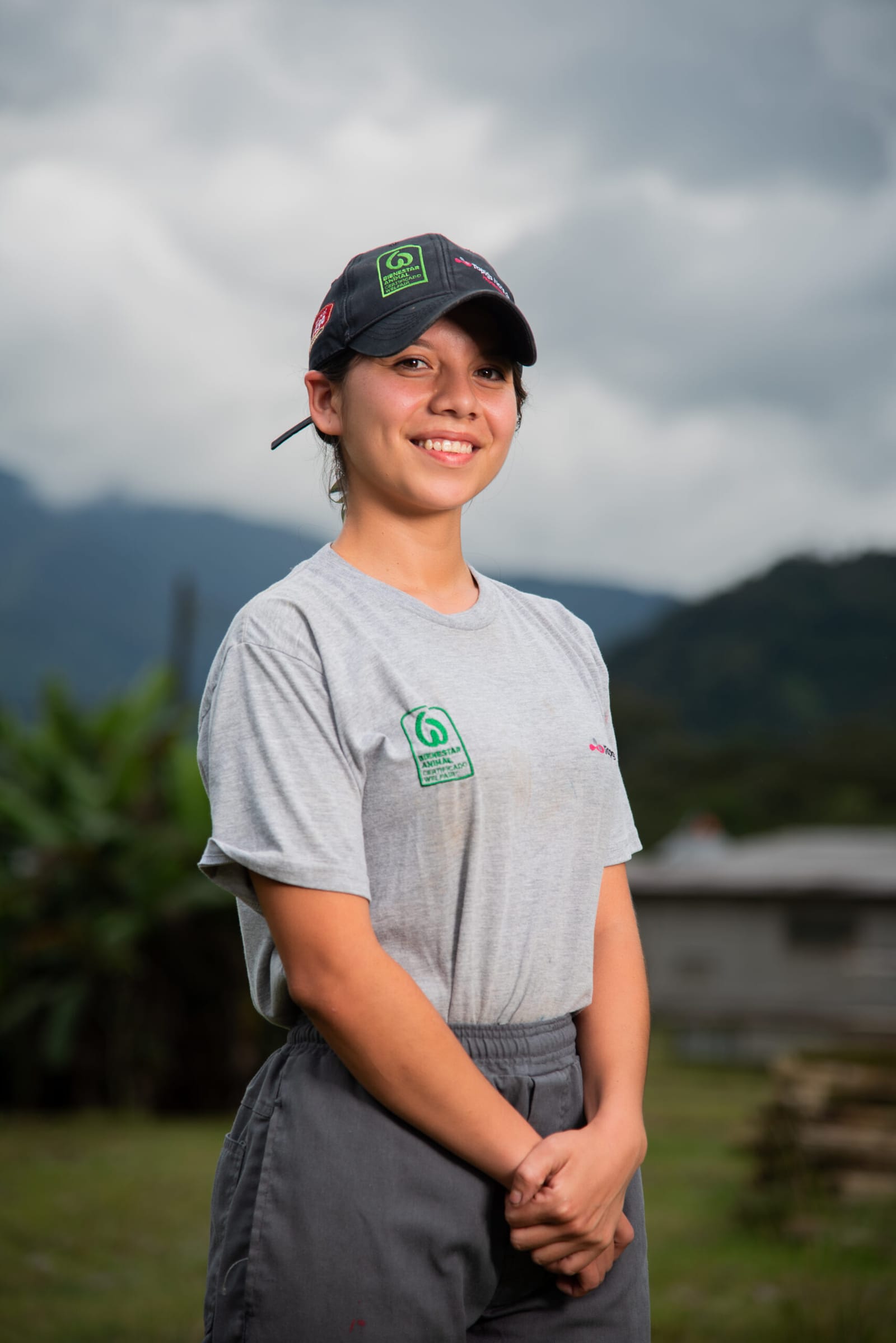 Portrait of a group worker wearing the team shirt, out in the field